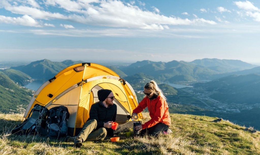 Couple camping on mountain top