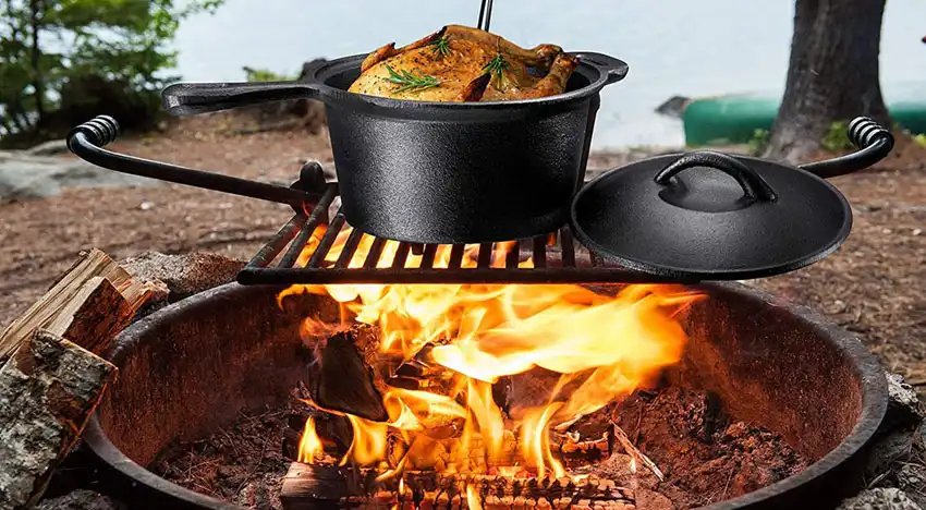 Camp cooking over the fire pit, open fire, dutch ovens